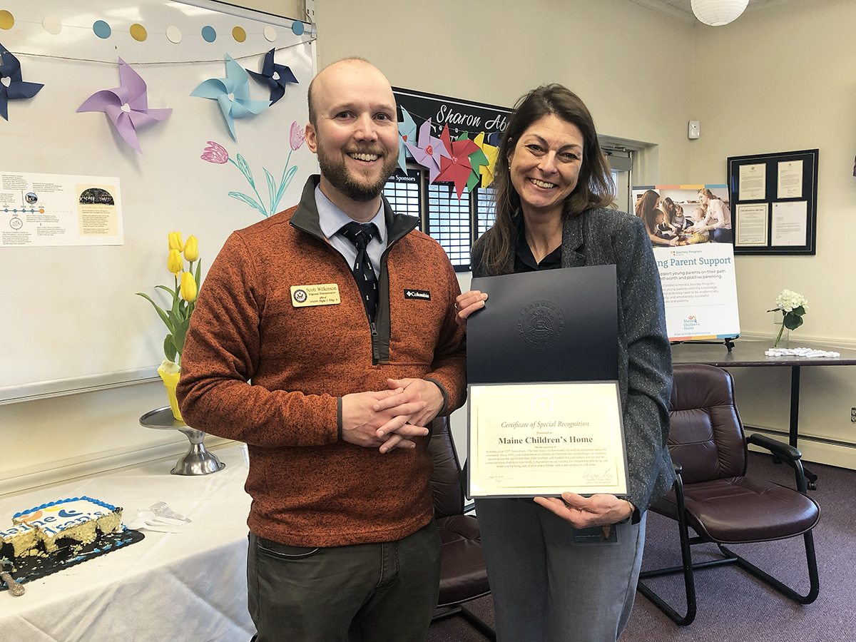Regional Representative of Senator Angus King's office Scott Wilkinson presented Executive Director Candace Marriner with a Certificate of Special Recognition of Maine Children's Home signed by the senator.