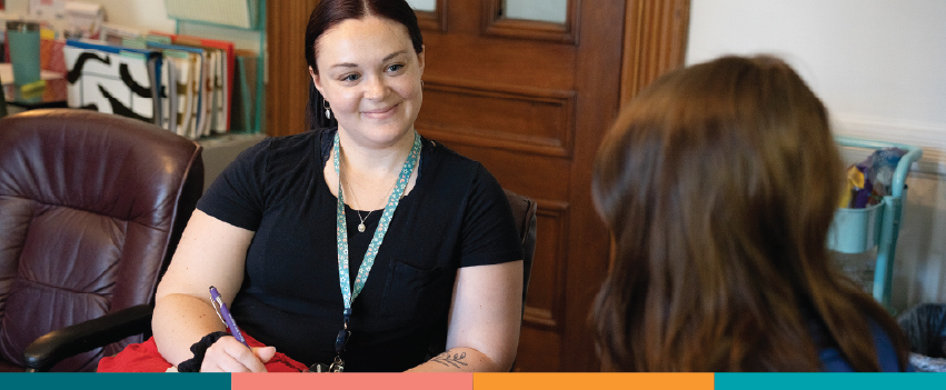 Case Manager Kayla (left) meets with Journey Program participant Kianna (right) as part of an education and economic mobility initiative.