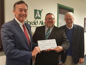 Chairman of the Harold Alfond Foundation, Greg Powell, with The Maine Children's Home's Executive Director Rick Dorian and Development Director Steve Mayberry.