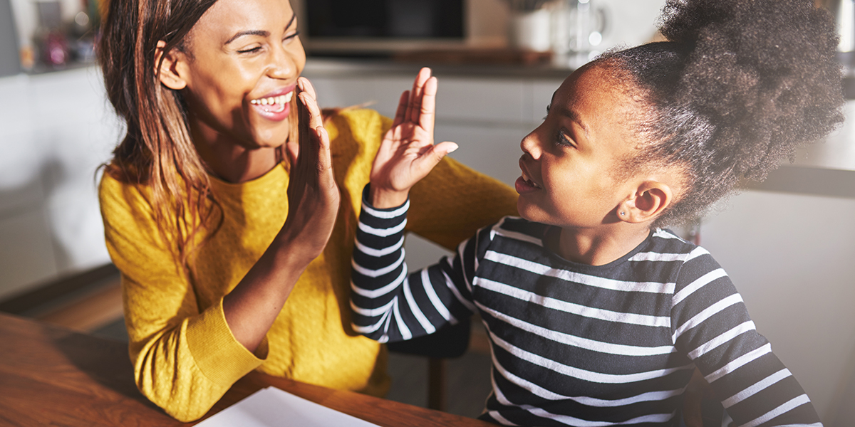 Mother and daughter high five