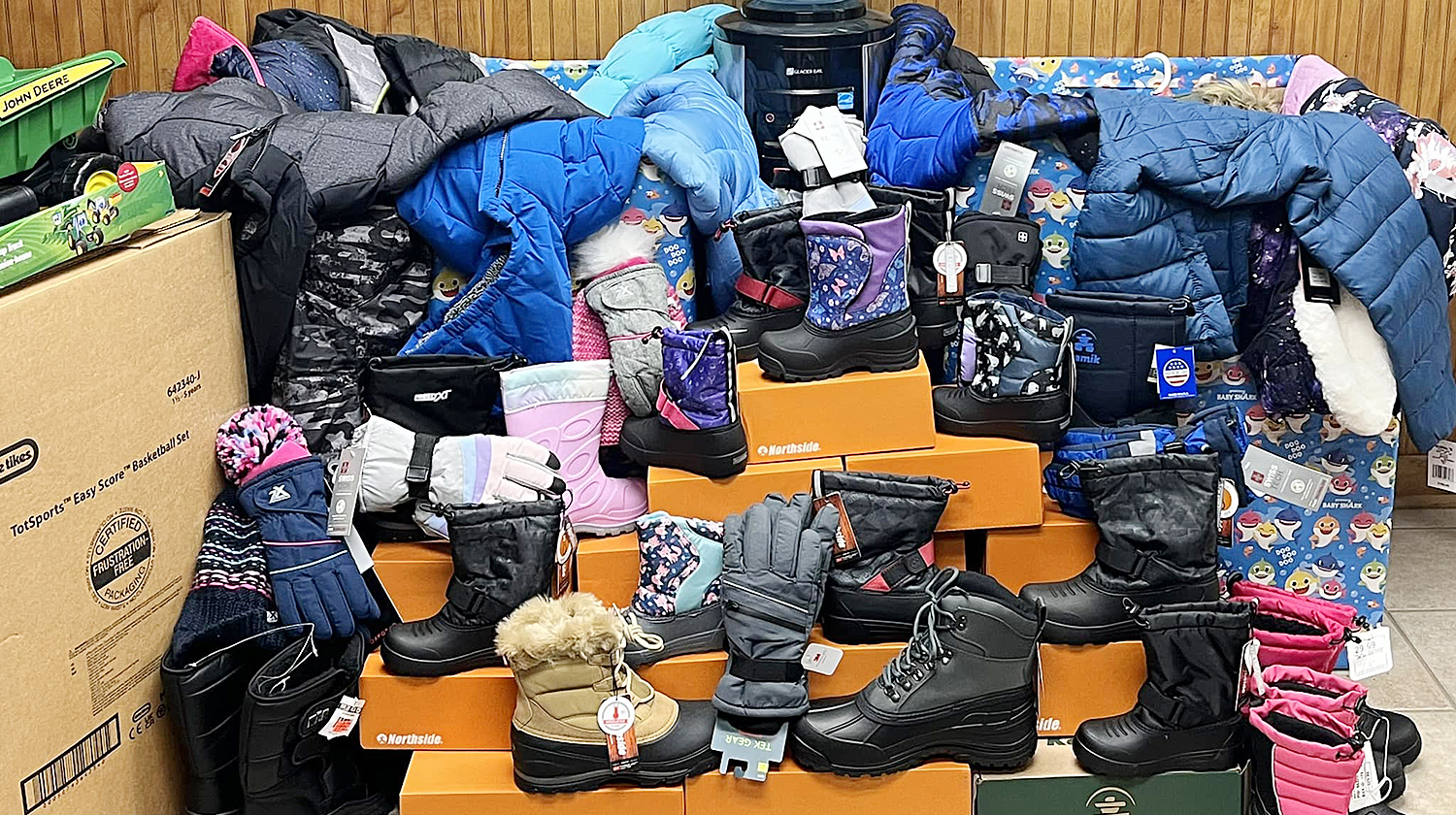 Donation of boots and winter jackets from Statewide Towing Inc.