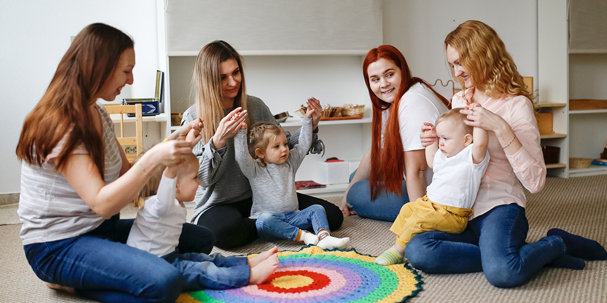 Mothers playing with their children